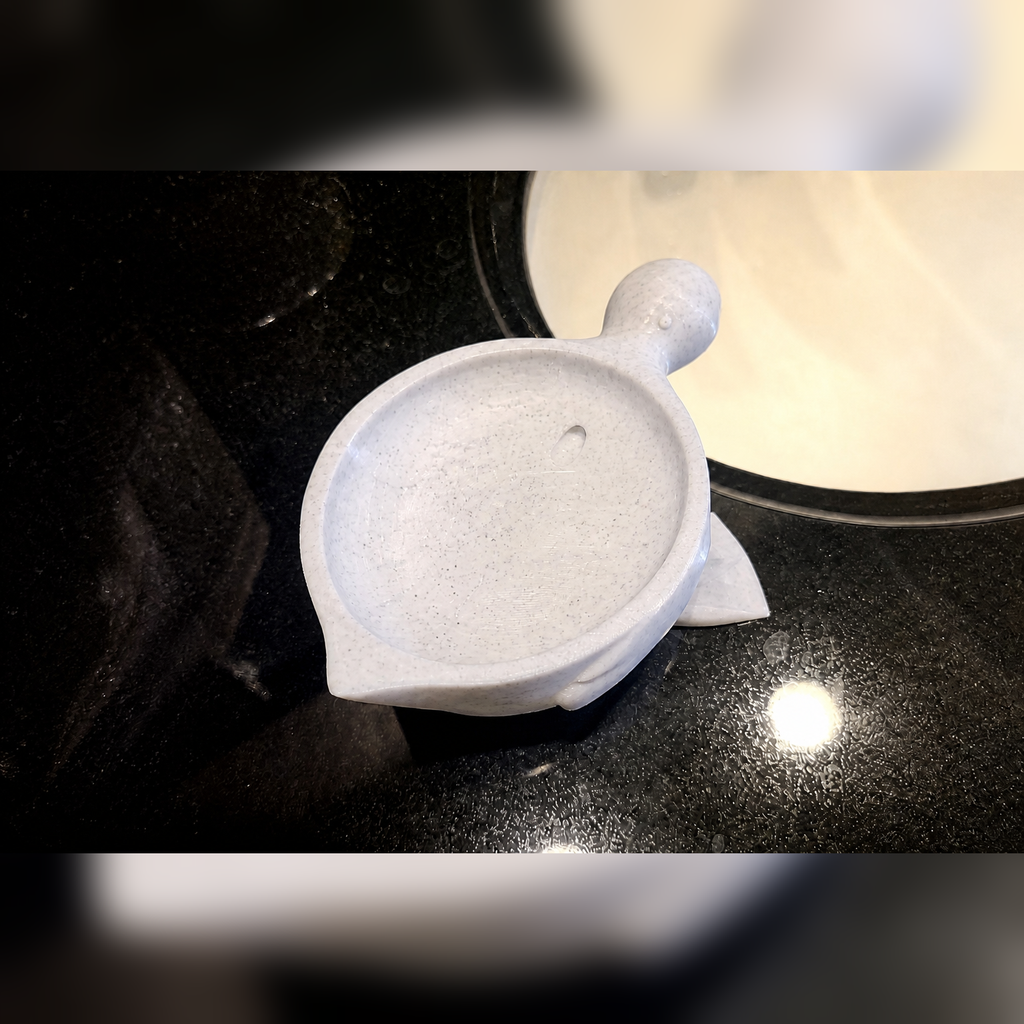 Top view of marble-white duck soap dish with drainage hole