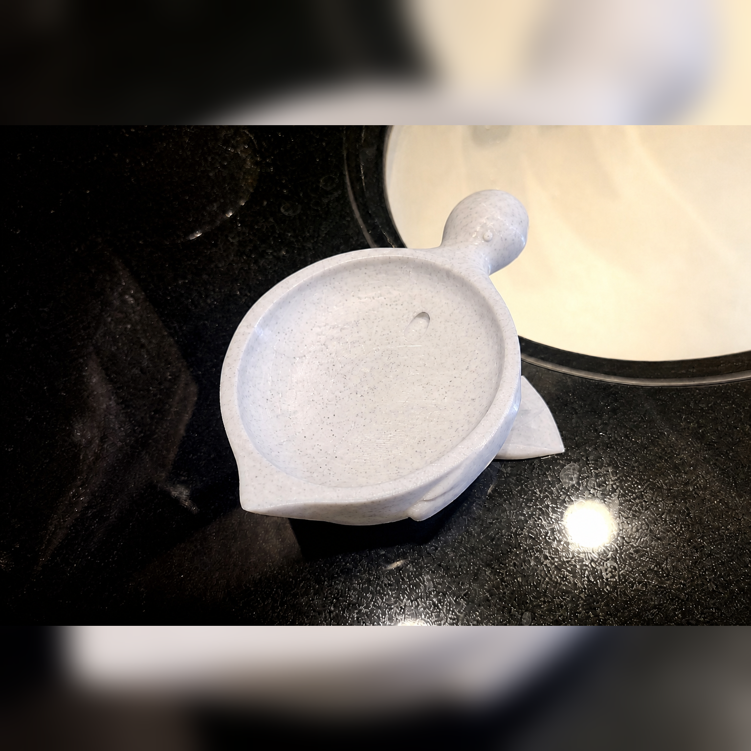 Top view of marble-white duck soap dish with drainage hole